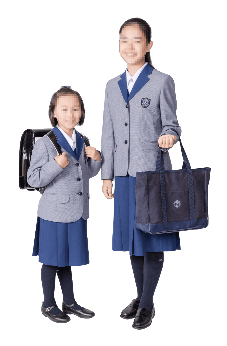 小林聖心女子学院の冬服制服。千鳥格子ブレザー・ロイヤルブルーのジャンパースカート・紺ハイソックスの新制服スタイル(小学生・中学生)
