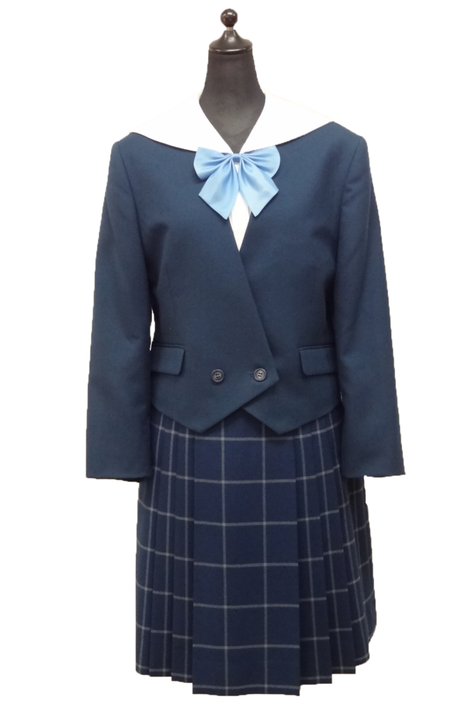 富山南高校の女子冬服制服。山本寛斎デザインの紺ブレザーと水色リボン、チェックプリーツスカートのスタイル